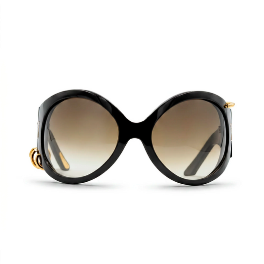 Black sunglasses with gold accents on a white background